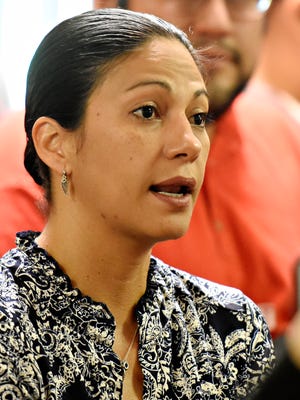 Audience member Patricia Zapata, currently of York City, shares her story of leaving Puerto Rico just three months ago during a debate between U.S. House Rep. Scott Perry, of District 4, and Democratic 10th Congressional District candidates George Scott, Shavonia Corbin-Johnson and Alan Howe at CASA in York City, Saturday, May 12, 2018. Dawn J. Sagert photo