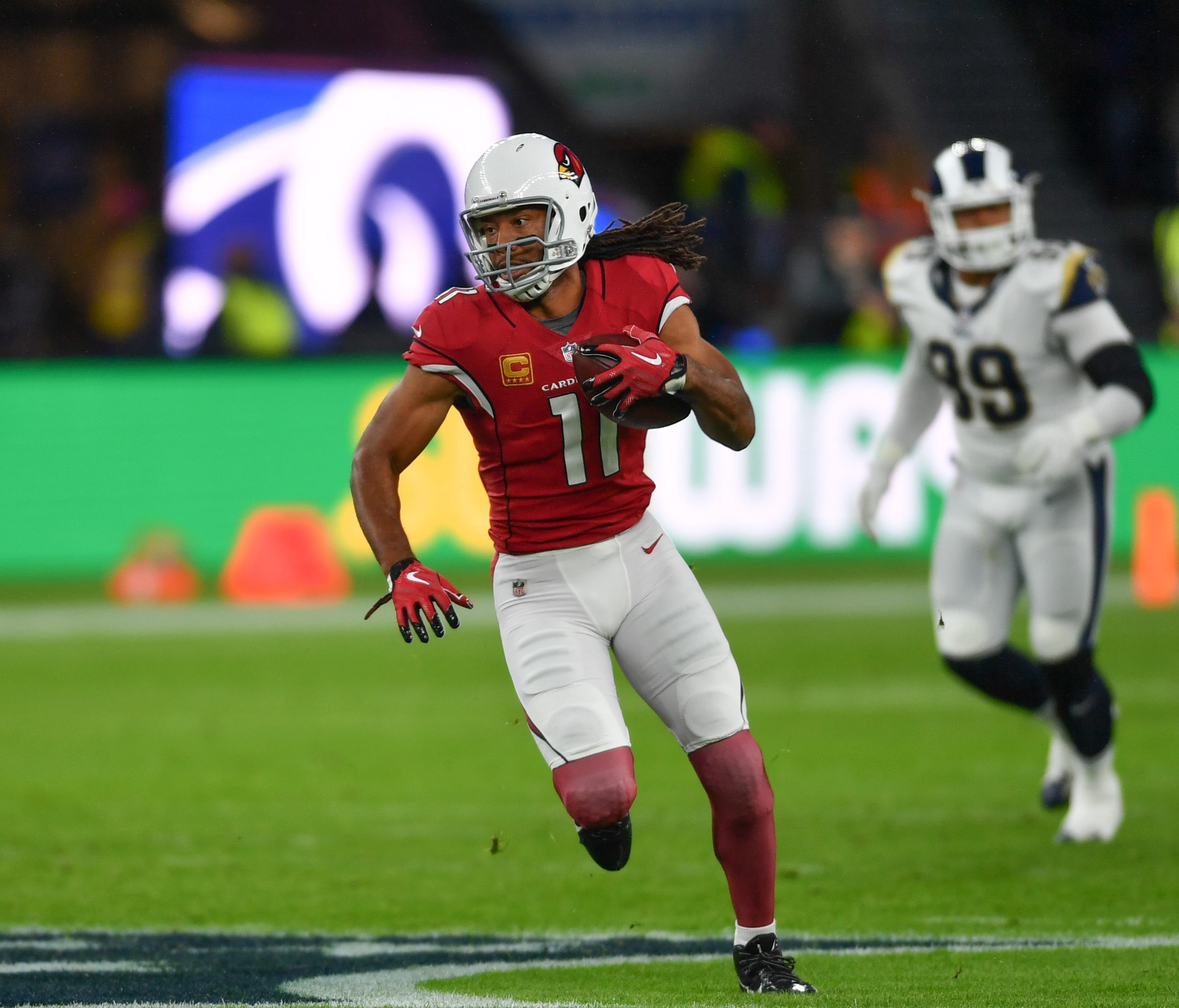 Arizona Cardinals wide receiver Larry Fitzgerald (11) makes a run in the first quarter during the NFL International Series game against the Arizona Cardinals at Twickenham Stadium.