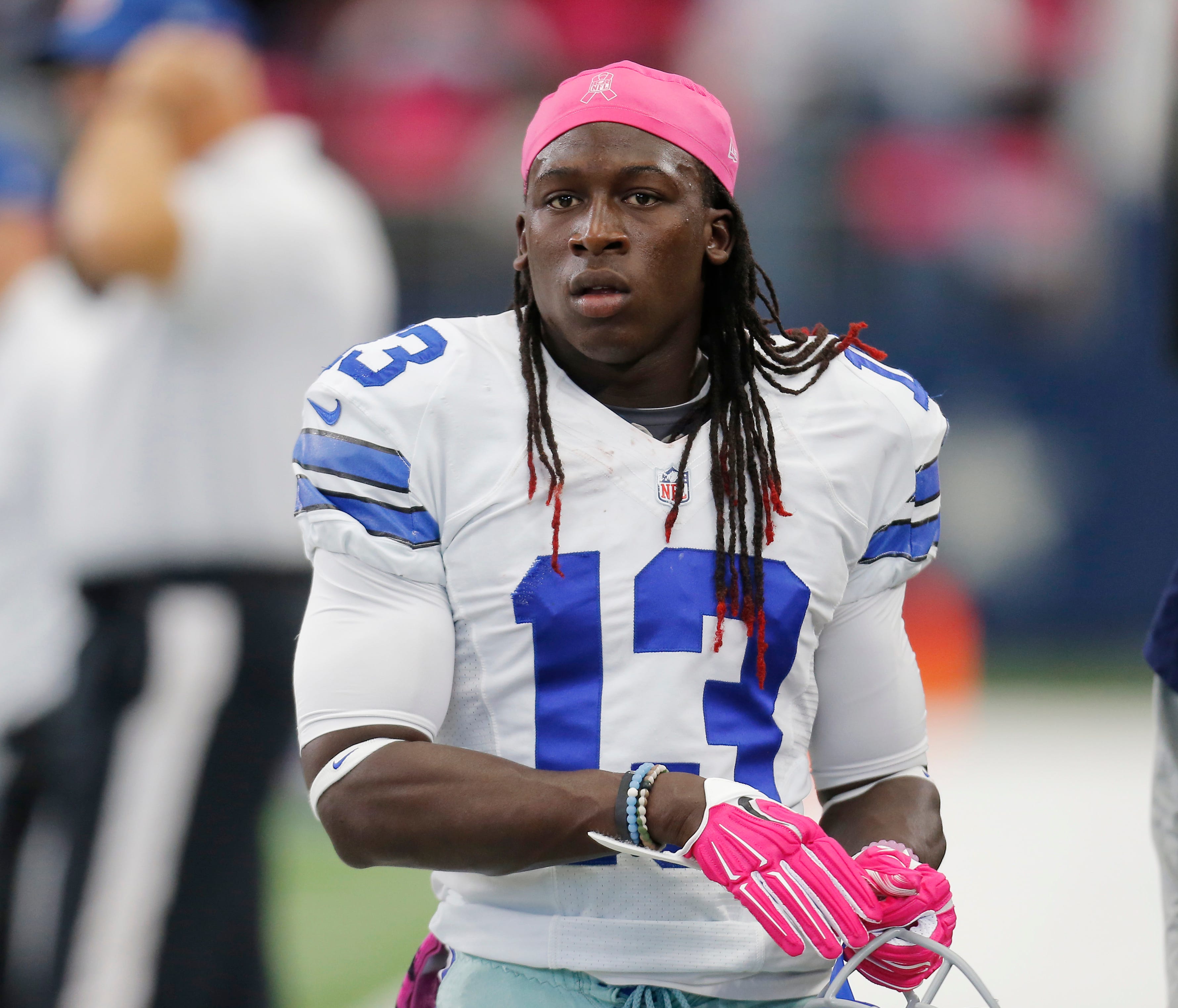 FILE - In this Oct. 11, 2015, file photo, Dallas Cowboys' Lucky Whitehead (13) prepares before an NFL football game against the New England Patriots in Arlington, Texas. Whitehead is asking for help locating his pitbull Blitz after burglars took the 