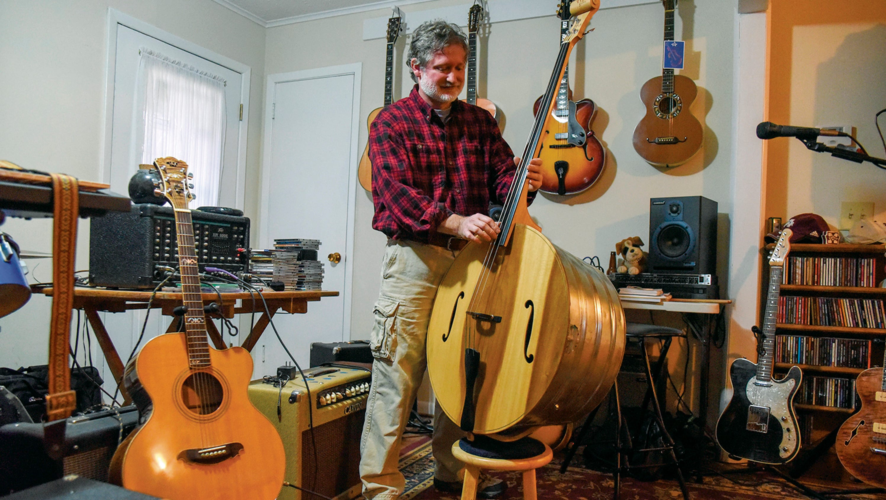 Musician Tim Yoder both plays, builds guitars