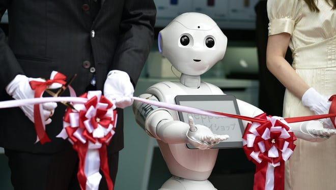 Pepper the robot participates in a Japanese ribbon-cutting ceremony earlier this year. Its manufacturer, SoftBank Robotics, is opening new offices in San Francisco and releasing a development kit for Android programmers.
