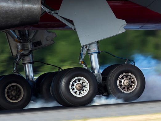 Tires meet asphalt as a DHL Boeing 757-200 touches