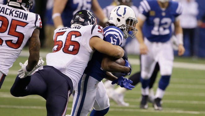 Houston Texans linebacker Brian Cushing, left, stops Indianapolis Colts wide receiver T.Y. Hilton during the second half of their game Sunady in Indianapolis. The Texans won 22-17.