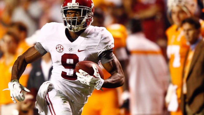 Alabama junior receiver Amari Cooper caught nine passes for a single-game school record 224 yards and two touchdowns in the Crimson Tide's 34-20 win at Tennessee.
