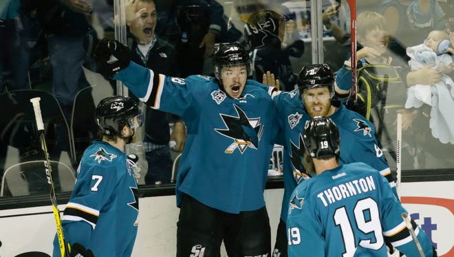 San Jose Sharks center Tomas Hertl (48) is congratulated by his teammates for scoring a goal against the St. Louis Blues during the first period in game three of the Western Conference Final of the 2016 Stanley Cup Playoffs at SAP Center at San Jose.