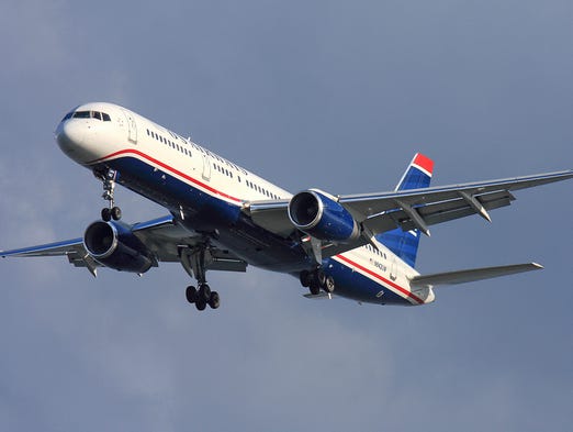 A US Airways Boeing 757-200 lands at Boston Logan International
