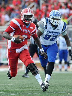 Delaware State University's quarterback #9 Esayah Obado runs with the ball in their 30-31 loss against Chowan College.