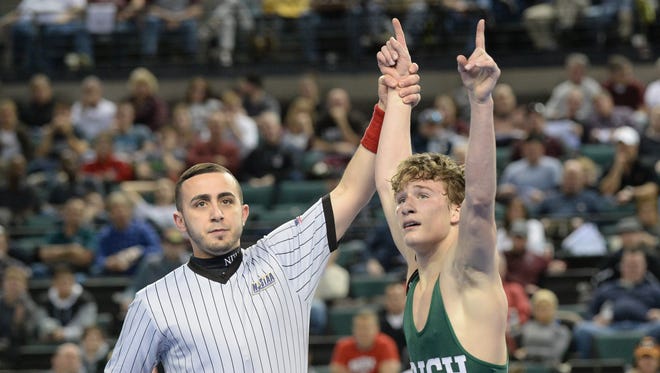Camden Catholic's Lucas Revano reacts after defeating Howell's Kyle Slendorn in the 132-pound state final match last March. The senior is back to defend his state title, bumping up to the 145-pound weight cal