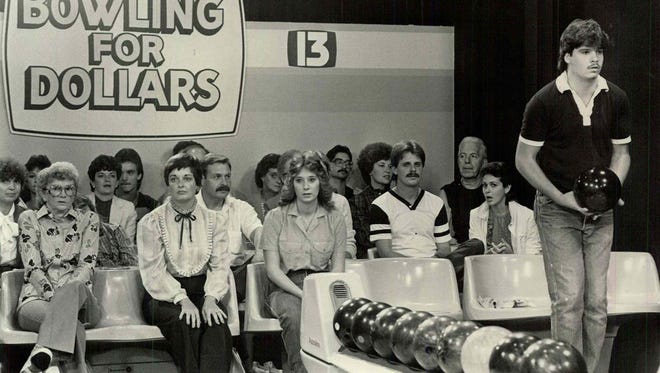 A Bowling for Dollars contestant lines himself up with the pins during a show in September 1984.