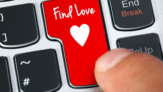 Computer keyboard key with find love and heart icon concept for online internet dating
