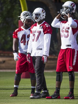 Defensive players wait their turn to perform at the Arizona Cardinals Tempe facility, Monday, May 16, 2016.  From left to right are; Quayshawn Nealy, Alex Okafor, Chandler Jones and D.J. Swearinger.
