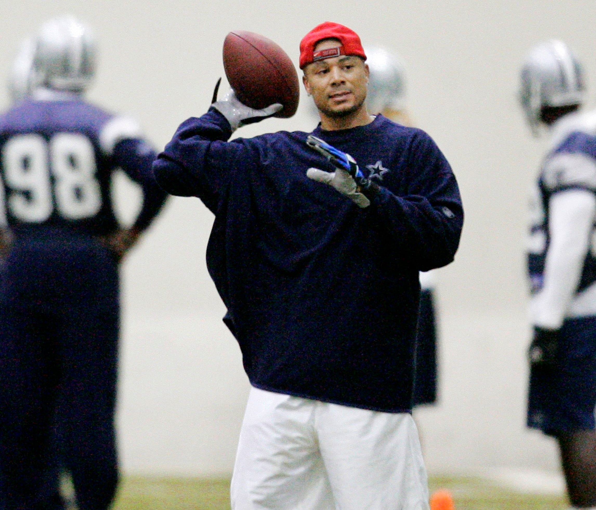 Dallas Cowboys wide receiver Terry Glenn tosses the ball after making a reception during practice at the Cowboys training facility in Irving, Texas, Tuesday, Dec. 12, 2007. Glenn went through some drills at practice for the first time all season Wedn