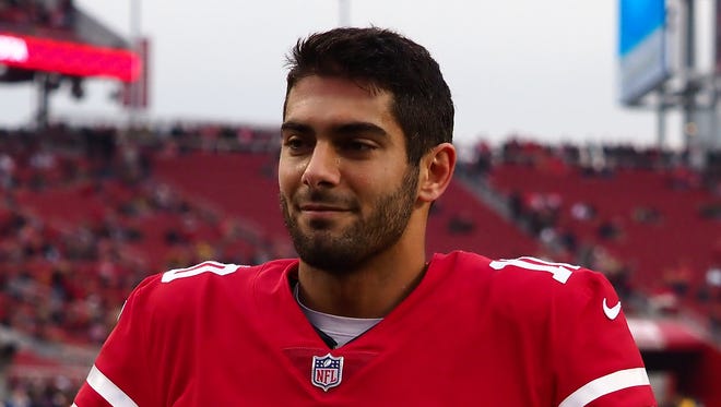 San Francisco 49ers quarterback Jimmy Garoppolo (10) walks to the sideline before a game against the Jacksonville Jaguars at Levi's Stadium.