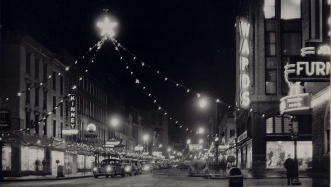 In the early 1950s East State Street in Ithaca was decorated with holiday lights, as seen in this photograph taken by Ithaca photographer Clayton Smith.