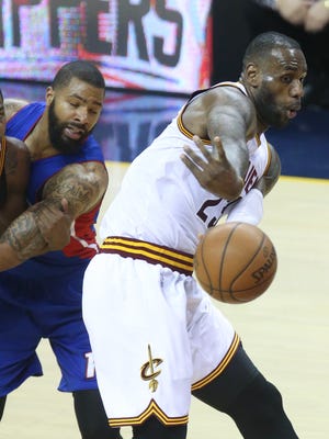 Pistons forward Marcus Morris defends against Cavaliers forward LeBron James during the third period of the Pistons' loss Wednesday in Cleveland.