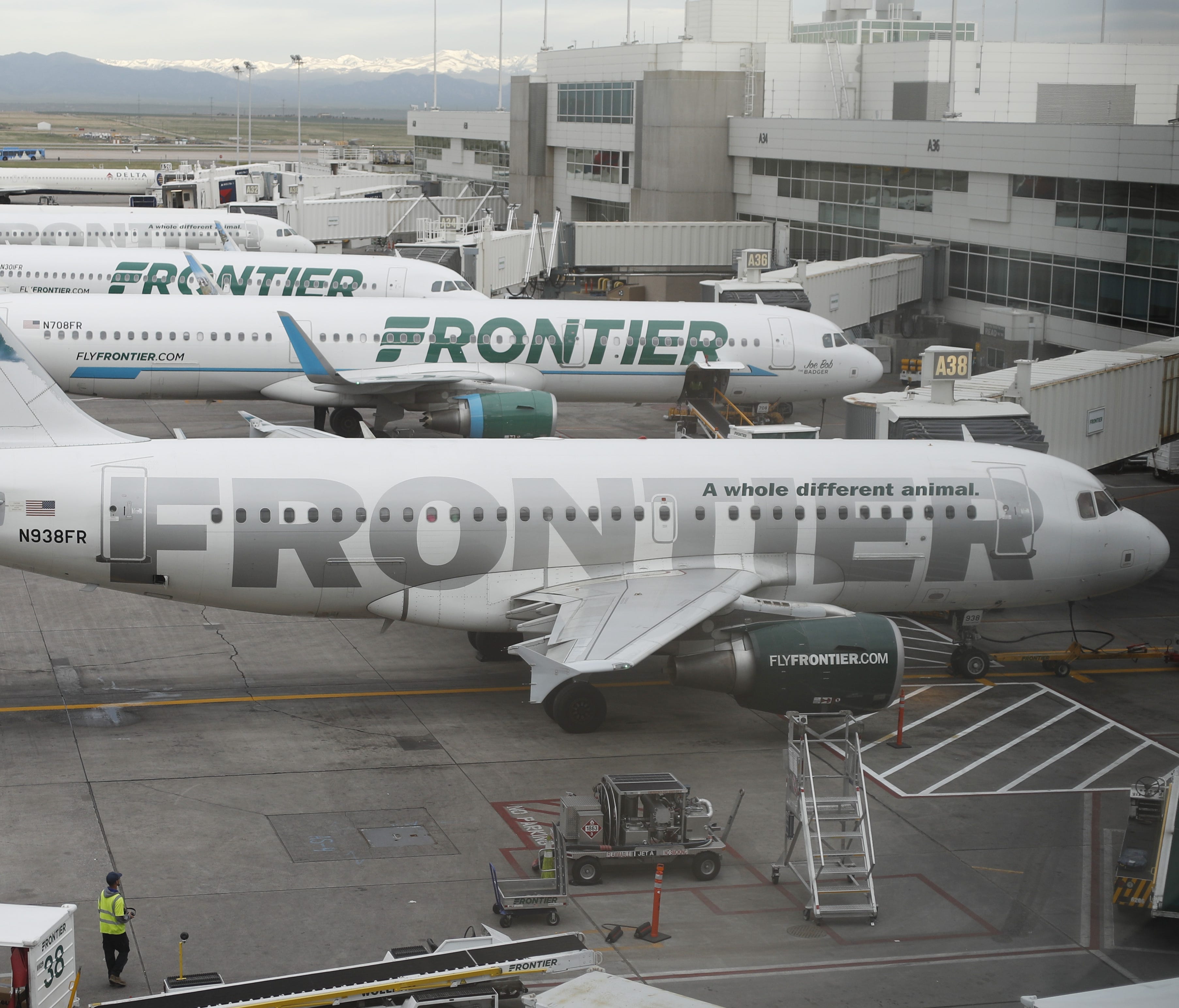 This file photo from May 15, 2017, shows Frontier Airlines jets at Denver International Airport.
