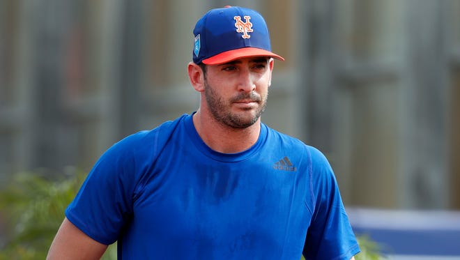 New York Mets pitcher Matt Harvey, left, talks with pitching coach Dave Eiland during spring training baseball practice Tuesday, Feb. 13, 2018, in Port St. Lucie, Fla. (AP Photo/Jeff Roberson)