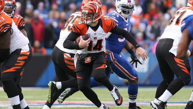 Oct 18, 2015; Orchard Park, NY, USA; Cincinnati Bengals quarterback Andy Dalton (14) scrambles and runs the ball during the second half against the Buffalo Bills at Ralph Wilson Stadium. Bengals beat the Bills 34 to 21. Mandatory Credit: Timothy T. Ludwig-USA TODAY Sports