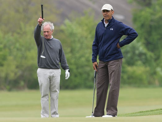 President Obama talks with Corker as they play golf
