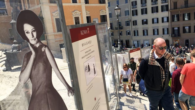 The Spanish Steps getting a makeover in Rome, Italy. Funded by Bulgari, images of famous Italian movie stars dot the barricades.