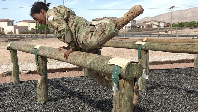 Pfc. Jamia Laird goes through the Air Assault Obstacle Course as part of the best medic competition for Charlie Company, 501st Brigade Support Battalion.