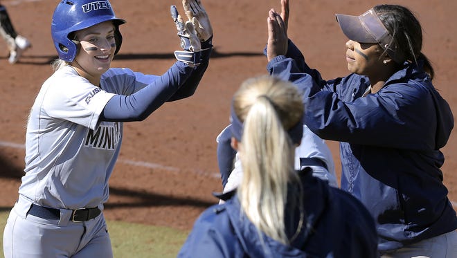 UTEP second baseman Courtney Clayton collects high fives as she makes her way to the dugout after scoring an insurance run in the bottom of the sixth inning on their way to winning the UTEP Softball Tournament 8-4 Sunday. UTEP went 5-0 through the tournament. 