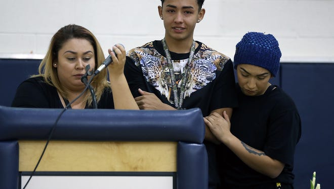 Genesis Soto’s siblings Jasmine Soto, left, Jason Soto and Mercedes Soto talk about their sister during a prayer vigil for Genesis and her daughter Andrea Soto who were seriously injured in a van accident that killed former Chapin basketball and football standout Cliff Tucker. 
