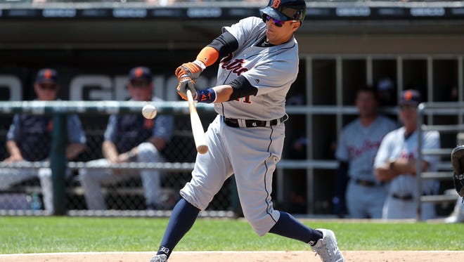 Jun 16, 2018; Chicago, IL, USA; Detroit Tigers designated hitter Victor Martinez hits a single during the third inning against the Chicago White Sox at Guaranteed Rate Field.