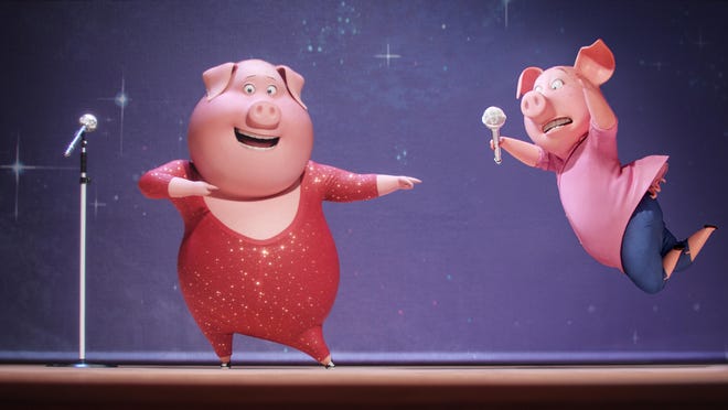 Gunter, voiced by Nick Kroll, left, and Rosita, voiced by Reese Witherspoon, appear in a scene from “Sing.”