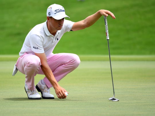 Aug 2, 2020; Memphis, Tennessee, USA; Justin Thomas lines up his putt on the first green during the final round of the WGC - FedEx St. Jude Invitational golf tournament at TPC Southwind. Mandatory Credit: Christopher Hanewinckel-USA TODAY Sports