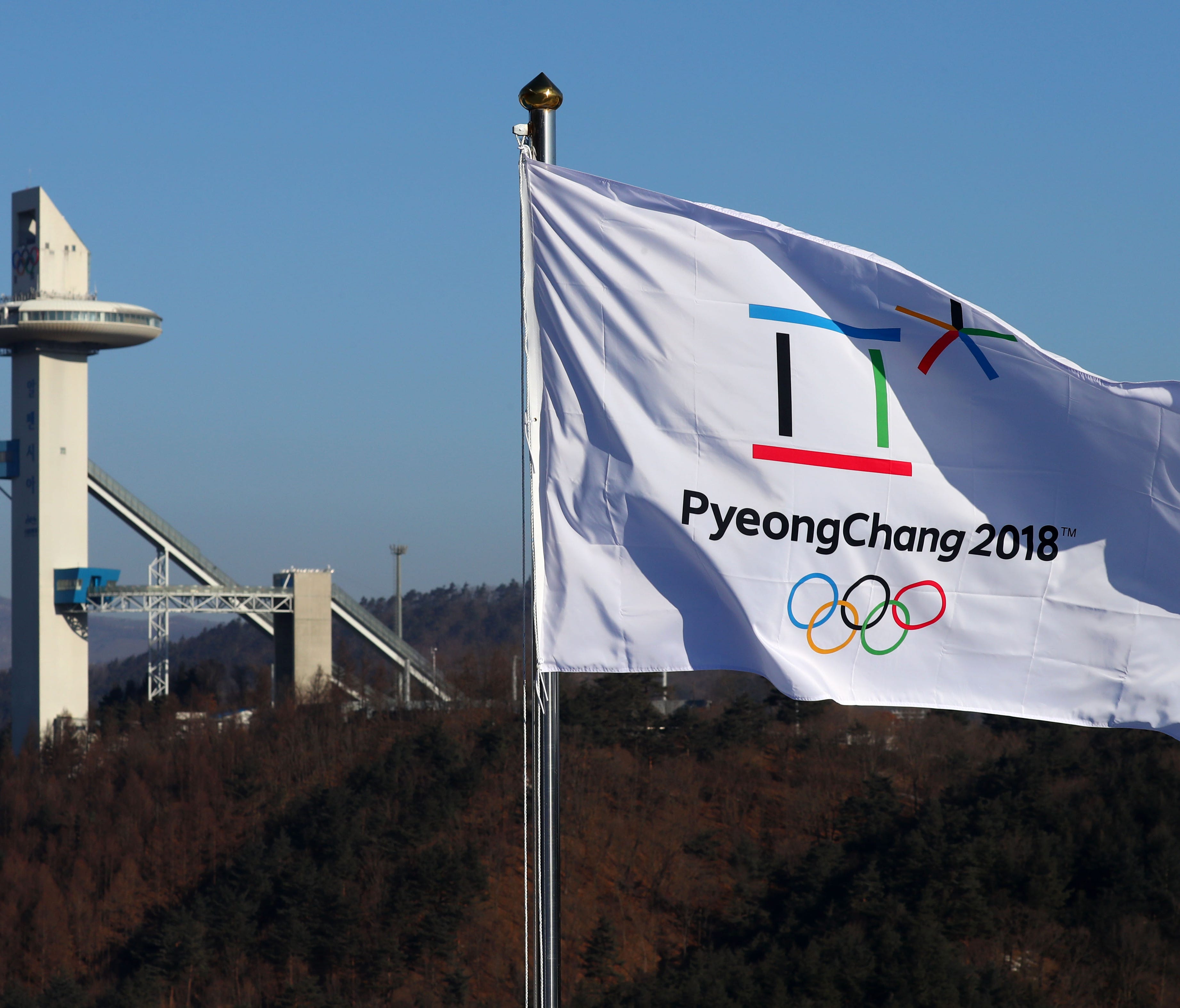 A Pyeongchang 2018 flag whips in the wind Wednesday.