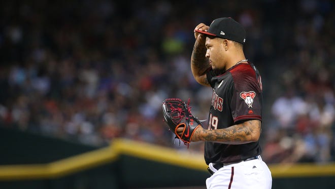 Diamondbacks pitcher Taijuan Walker (99) reacts to allowing five runs against the Marlins in the third inning at Chase Field in Phoenix, Ariz. on Sept 23, 2017.