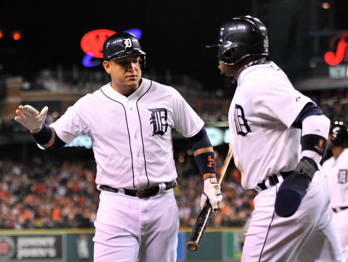 Tigers' Miguel Cabrera congratulates Rajai Davis after Davis scores in the fifth inning to make it 1-0 Tigers
