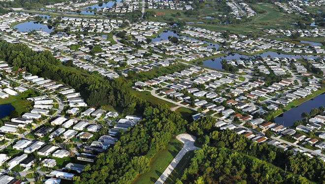 The Savanna Club development (top) and Spanish Lakes Golf Village (left) are seen east of U.S. 1 in Port St. Lucie in this 2014 file photo. St. Lucie County property values have increased 7.3 percent overall in the past year.