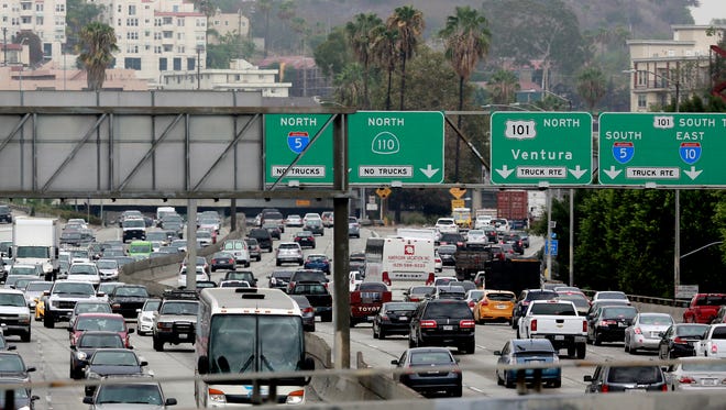 Vehicles are backed up while entering the US 101 Ventura Freeway in Los Angeles on Tuesday, Aug. 25, 2015.