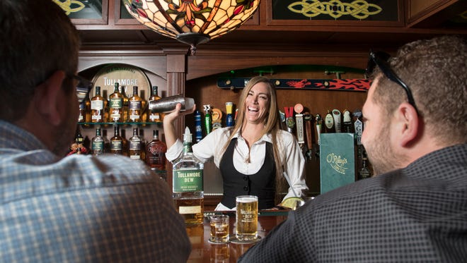 Bartender Mandy Kilgen makes a cocktail at O'Riley's Irish Pub in Pensacola on February 6, 2017.
