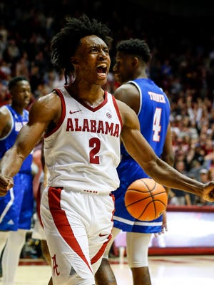 Alabama guard Collin Sexton (2) reacts after scoring a basket during the second half of an NCAA college basketball game against Texas-Arlington, Tuesday, Nov. 21, 2017, in Tuscaloosa, Ala. (AP Photo/Butch Dill)