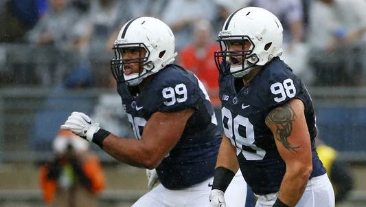 Penn State defensive tackle Anthony Zettel (98) and defensive tackle Austin Johnson (99) in pursuit during an NCAA college football game against Buffalo on Sept. 12.