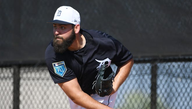 Tigers pitcher Michael Fulmer throws a bullpen session during a workout.