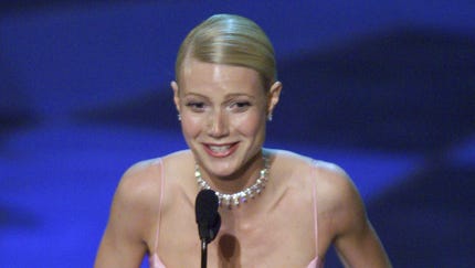 Gwyneth Paltrow wore a soft pink gown by Ralph...