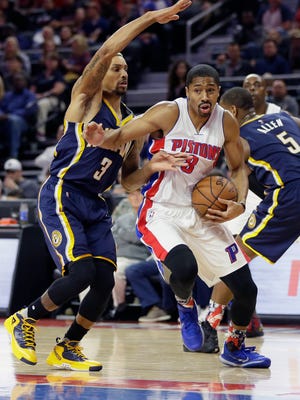 Detroit Pistons guard Spencer Dinwiddie, right, drives on Indiana Pacers guard George Hill during the second half Tuesday, Nov. 3, 2015, in Auburn Hills.