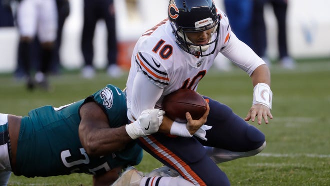 Chicago Bears' Mitchell Trubisky, right, is tackled by Philadelphia Eagles' Brandon Graham during the second half of an NFL football game, Sunday, Nov. 26, 2017, in Philadelphia.