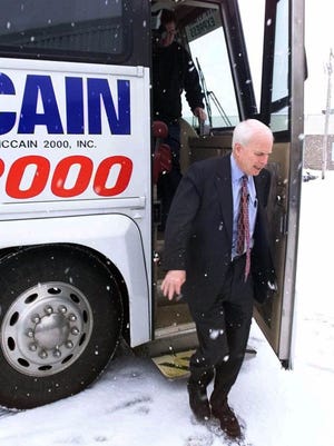 Sen. John McCain, R-Ariz., steps off his campaign bus in Nashua, N.H., on Jan. 13, 2000.
