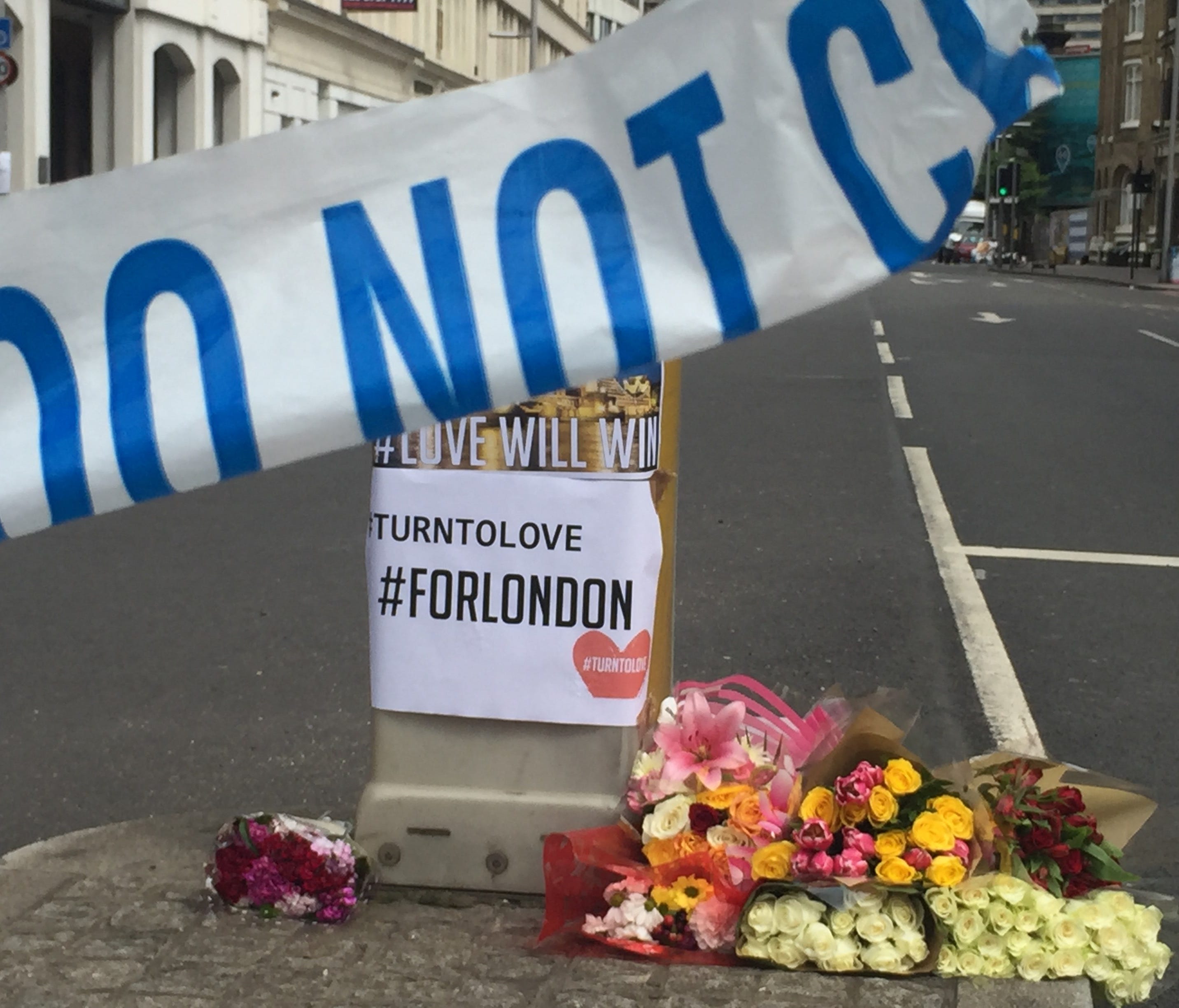 Floral tributes and posters near the scene of the terror attack in London Bridge.