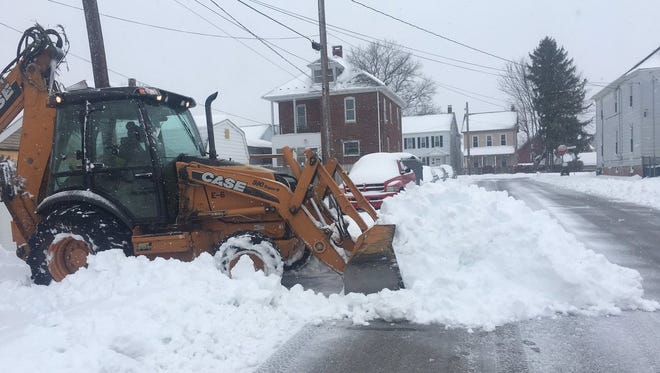 A front end loader moves snow in Hanover during Winter Storm Stella Tuesday, March 14, 2017. Alyssa Pressler photo