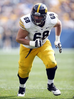 Iowa Hawkeyes offensive linesman Brandon Scherff (68) breaks off of the line of scrimmage against the Pittsburgh Panthers during the third quarter at Heinz Field. The Hawkeyes won 24-20.