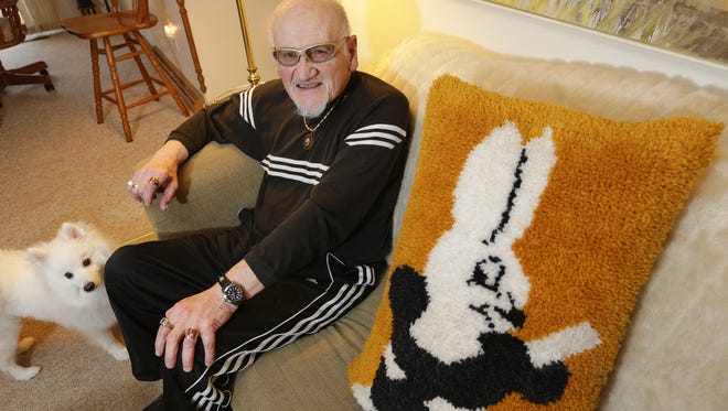 Retired magician Dick DeYoung in his home with his dog Spook Jan. 25 in Sheboygan Falls. DeYoung retired from magic two years ago after 65 years of performing.