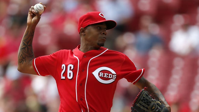 Reds starting pitcher Raisel Iglesias delivers to the plate in the first inning.