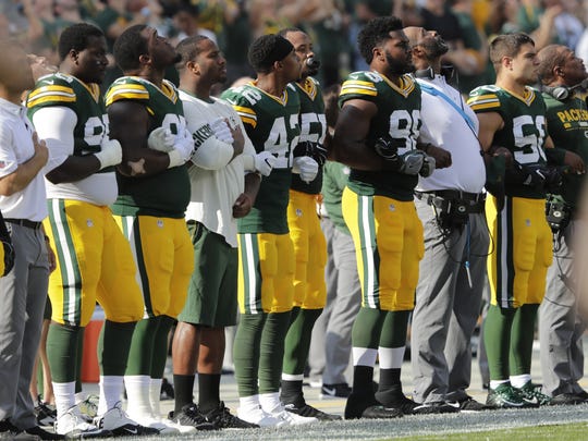 The Green Bay Packers are shown during the national anthem before their game against the Cincinnati Bengals  Sunday, September 24, 2017 at Lambeau Field in Green Bay, Wis. NFL players responded in full force Sunday after President Trump repeatedly called for swift punishment against those who chose to protest by not standing during the national anthem. Demonstrations spread throughout the league as many players broke out of their routine by joining the protests or engaging in team-wide displays of unity. Former San Francisco 49ers quarterback Colin Kaepernick began the protests last year by choosing not to stand during the anthem and remains a free agent, said he wanted to speak out against racial injustice and police brutality. 

DAN POWERS/APPLETON POST-CRESCENT