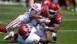 Oklahoma running back Marcellus Sutton is tackled Antoine